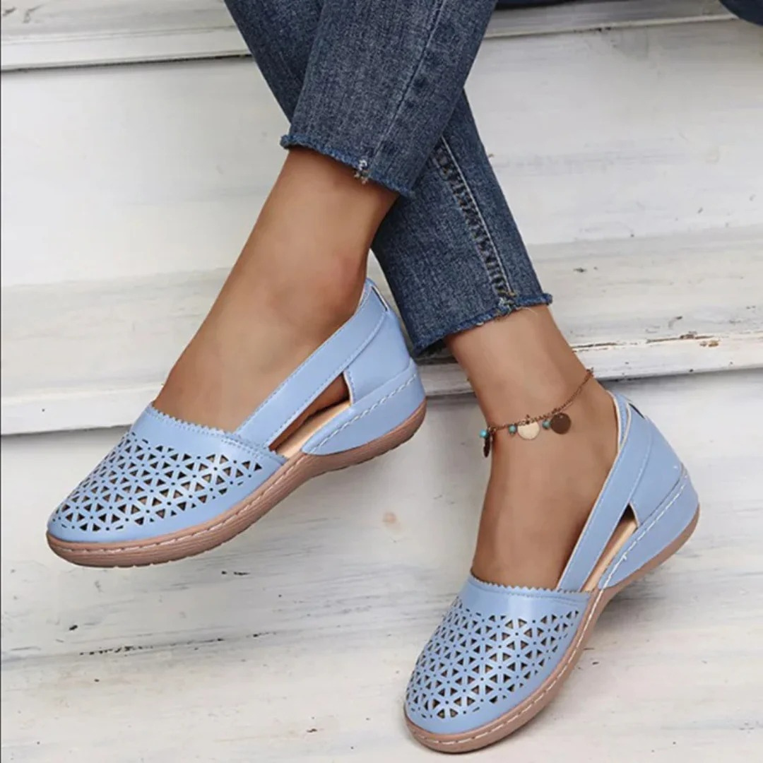 Women’s comfort walking shoes in light blue with perforated slip-on upper