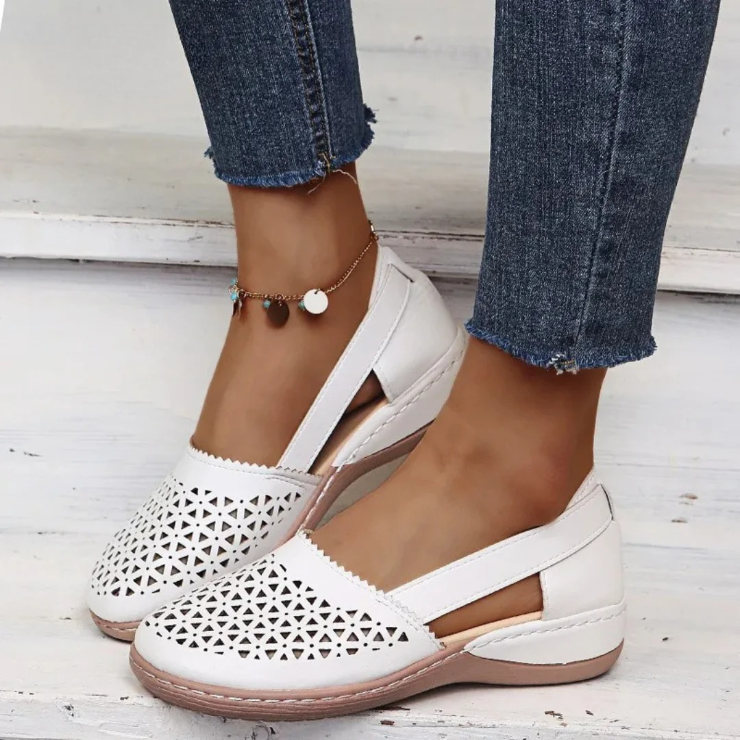 Women’s comfort walking shoes in white with perforated slip-on design