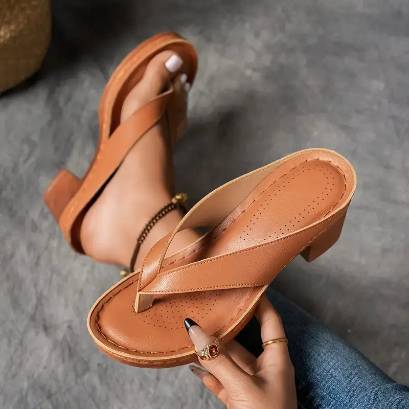Women’s brown cushioned platform slide sandals with cross strap and perforated footbed