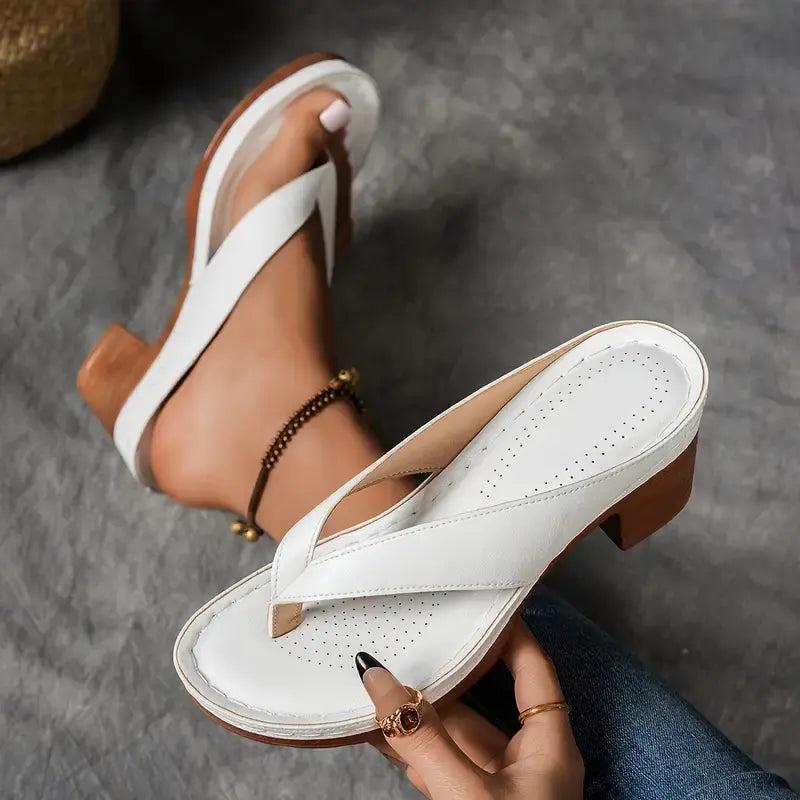 Women’s white cushioned platform slide sandals with cross strap and perforated footbed