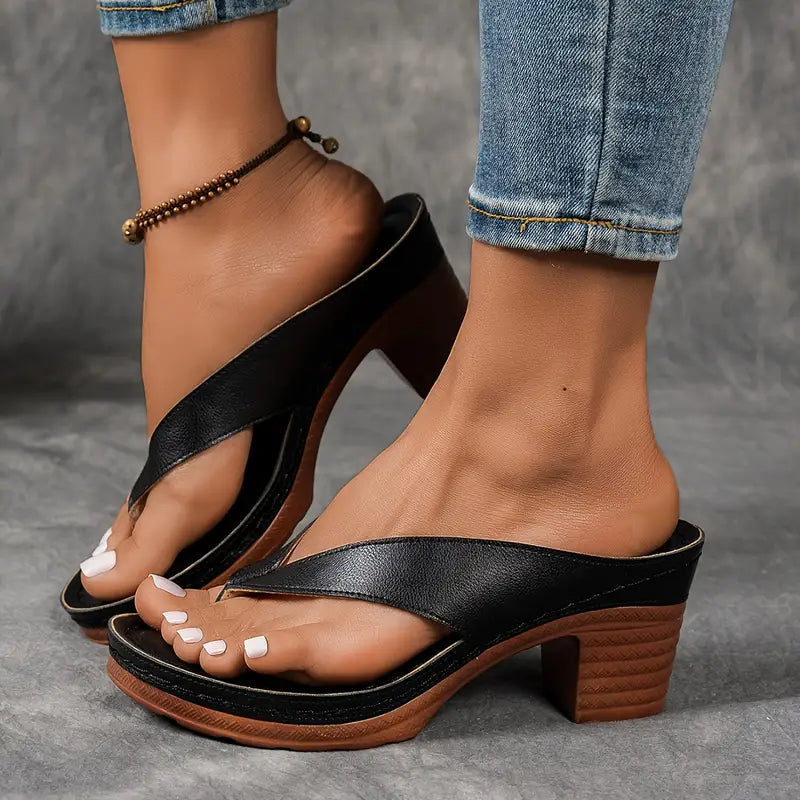 Women’s black cushioned platform slide sandals with cross strap and chunky block heel