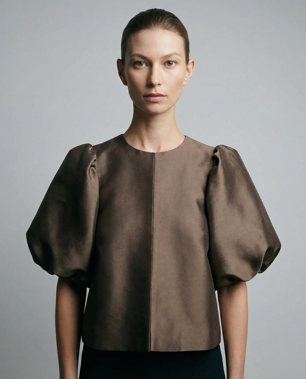 Brown satin blouse with short puff sleeves and front button placket