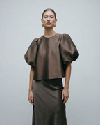 Dark brown satin blouse with voluminous puff sleeves and front button placket