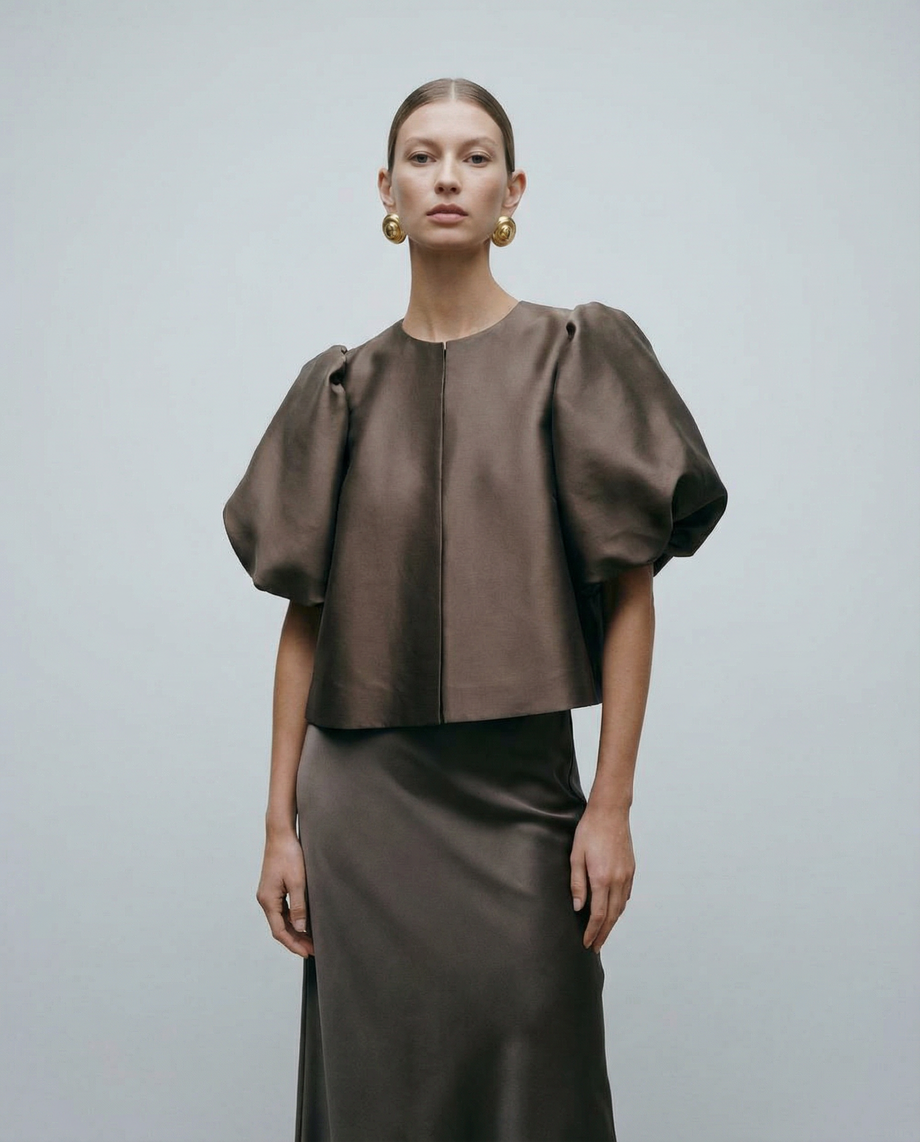 Dark brown satin blouse with voluminous puff sleeves and front button placket