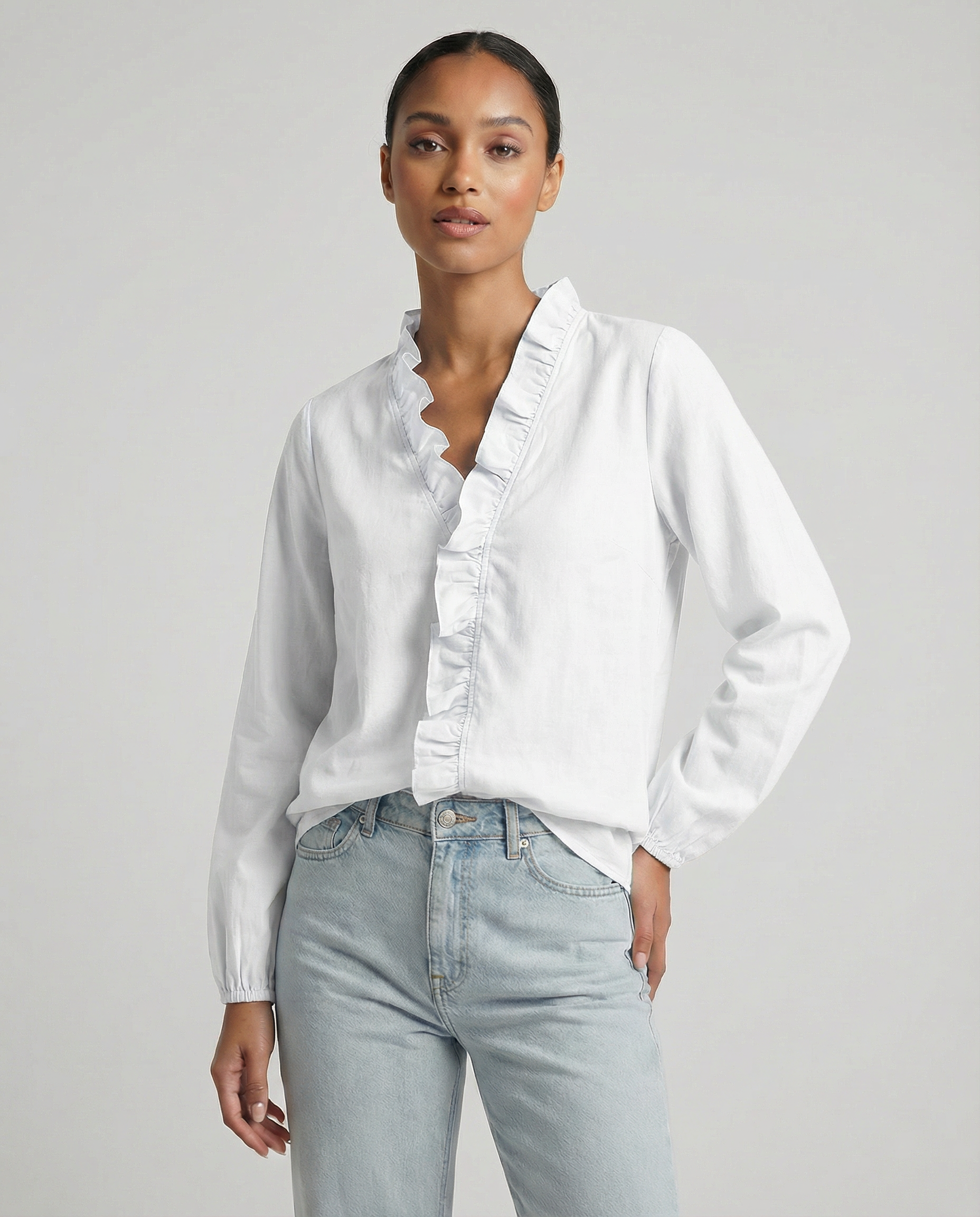 White ruffle V-neck blouse with long sleeves and button-front detail