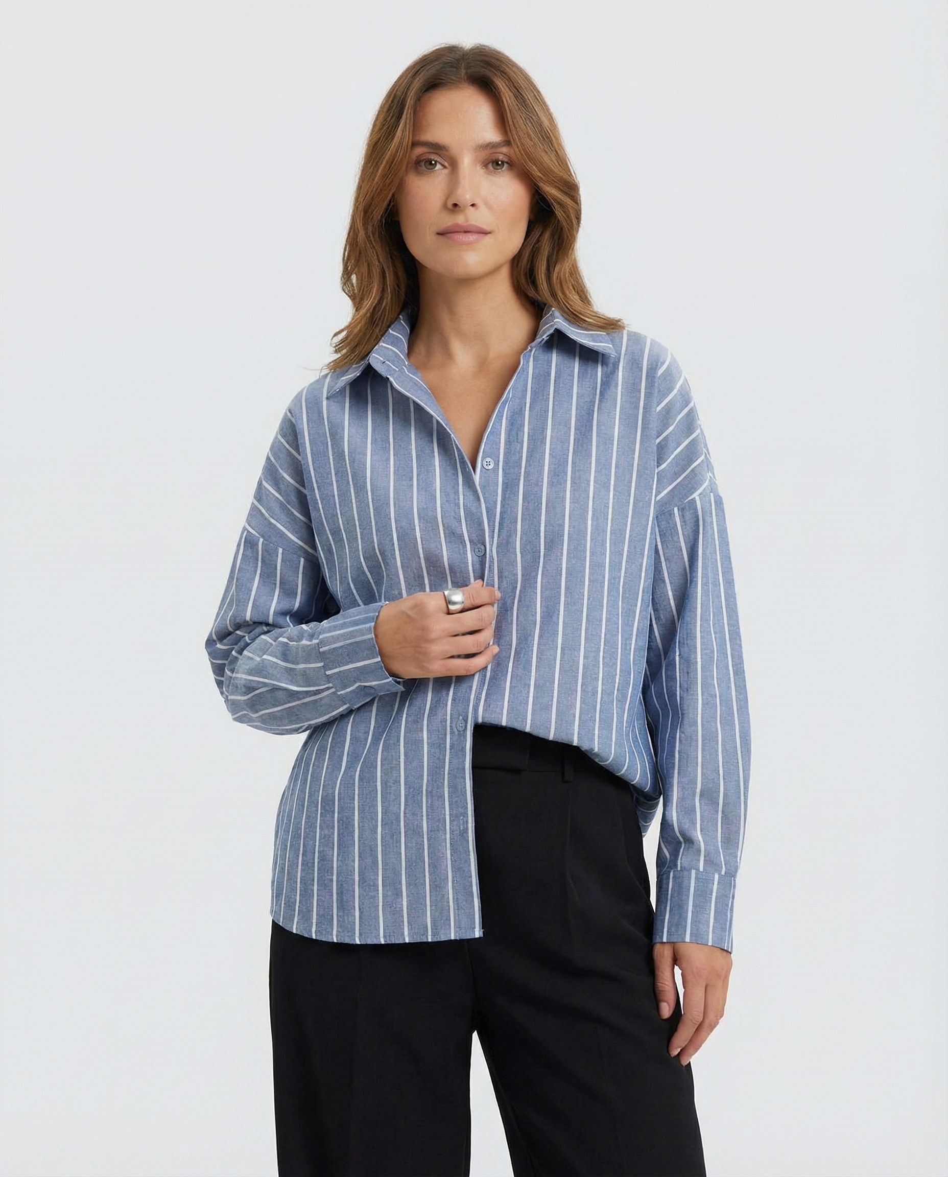 Blue striped button-down shirt with pointed collar and front button placket