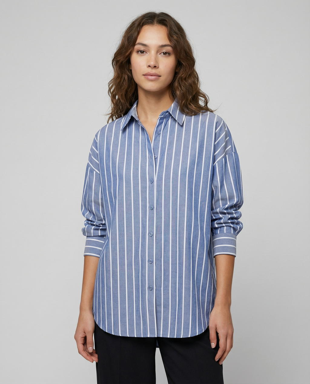 Blue striped button-down shirt with pointed collar, front buttons, and rolled cuffs