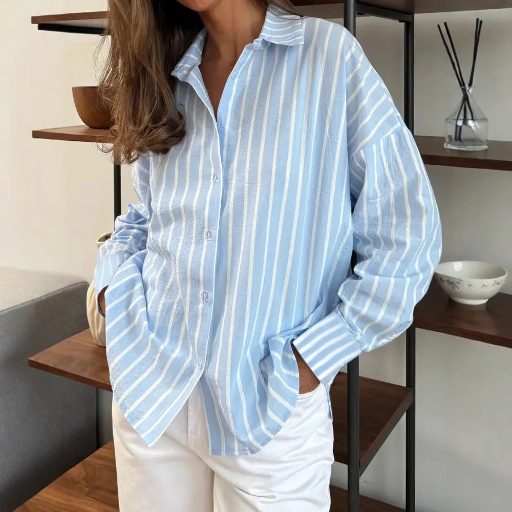 Light blue striped button-down shirt with long sleeves and front button placket