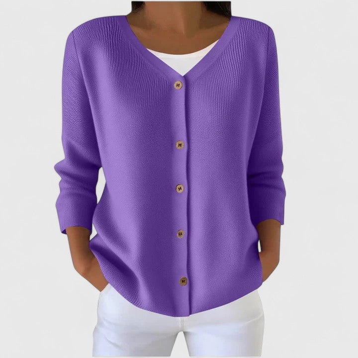Purple knit cardigan with V-neck button front and three-quarter sleeves.