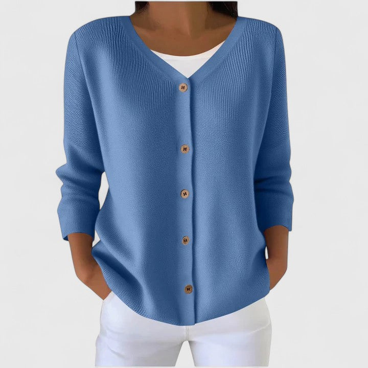 Blue knit cardigan with V-neck button front and three-quarter sleeves.