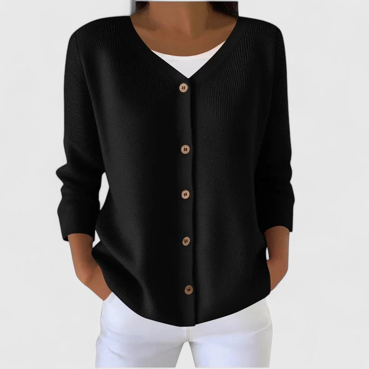 Black knit cardigan with V-neck button front and three-quarter sleeves.