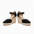 Black ankle-strap wedge sandals with buckle and textured espadrille platform sole