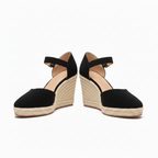 Black ankle-strap wedge sandals with buckle and textured espadrille platform sole