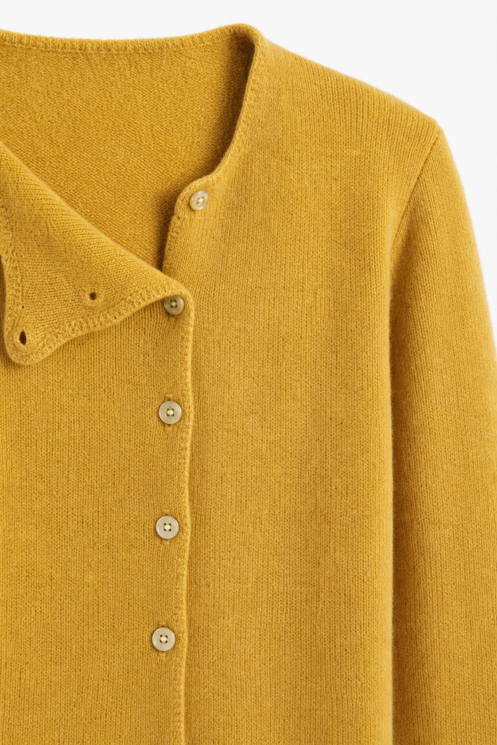 Mustard yellow asymmetrical button knit sweater with long sleeves and front button placket