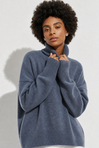 Blue oversized merino blend turtleneck sweater with ribbed cuffs and hem