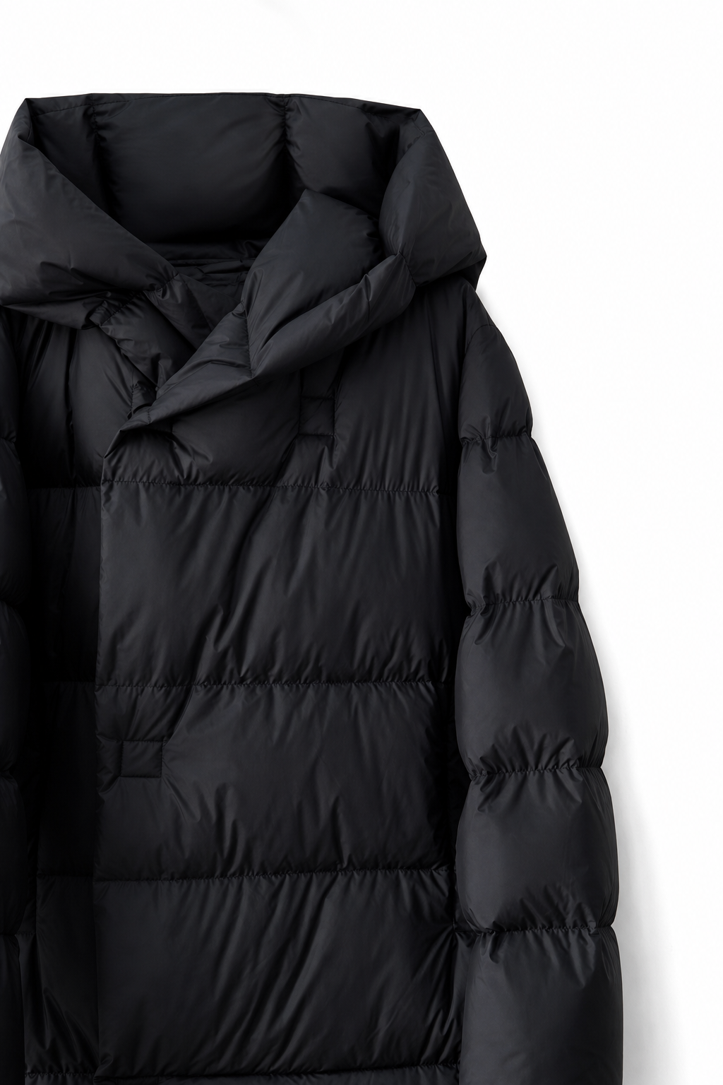 Black long down puffer parka hood with quilted baffles and insulated padded sleeves
