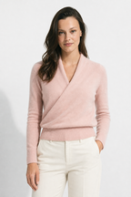 Pink crossover collar knit sweater with long sleeves and ribbed hem
