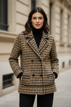 Camel and black houndstooth knit jacket with notched lapels and button front.