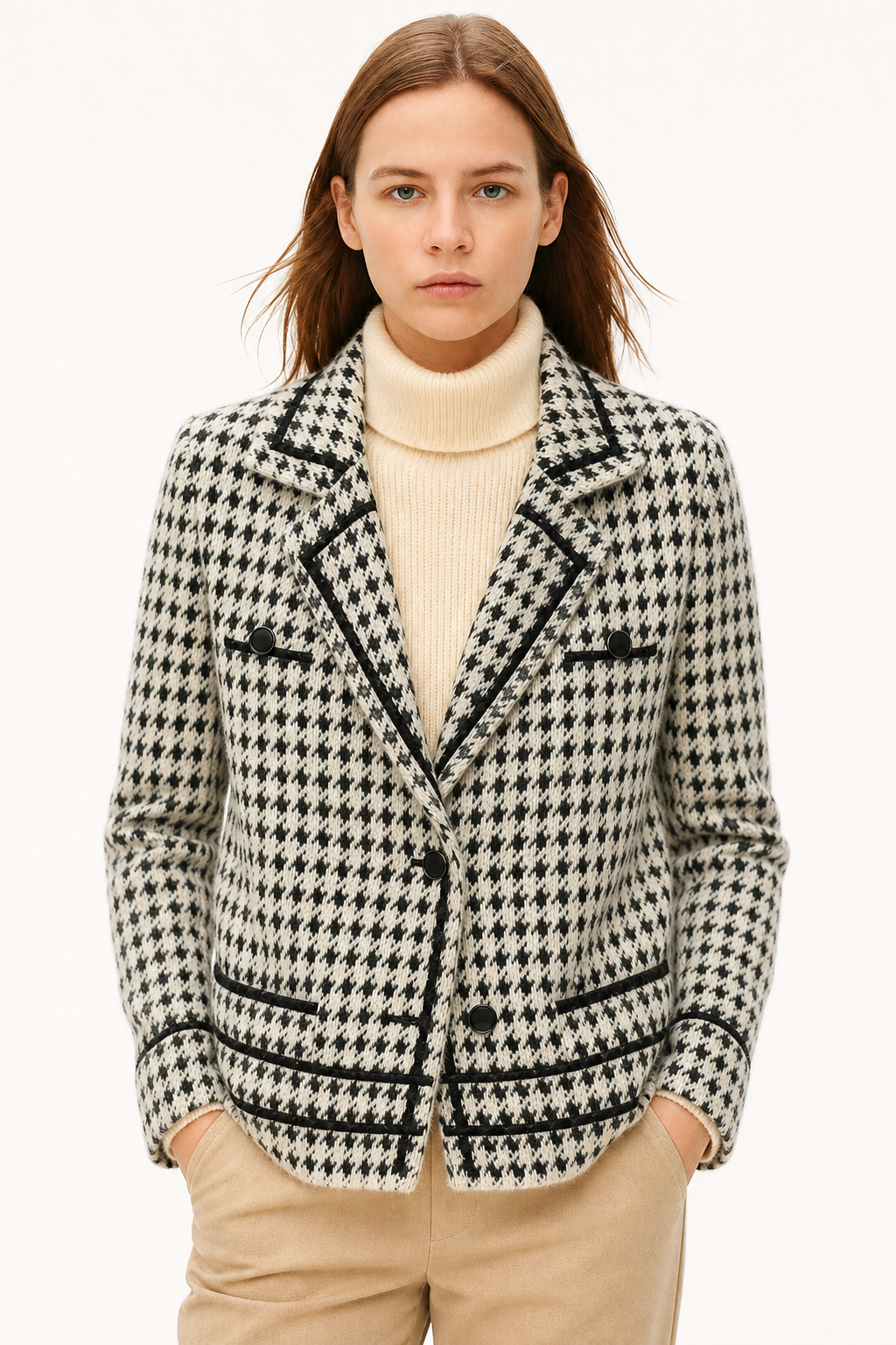 Houndstooth knit jacket with ribbed high collar, button front, and black trim details