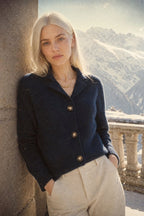 Women’s button-front cardigan sweater in navy blue, long sleeves, ribbed trim