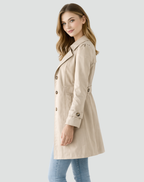 Beige women's slim-fit lightweight trench coat with lapels, button front, waist belt