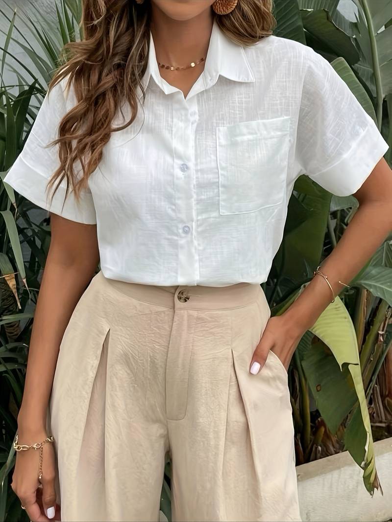 White short-sleeve cotton button-up shirt with pointed collar and chest pocket