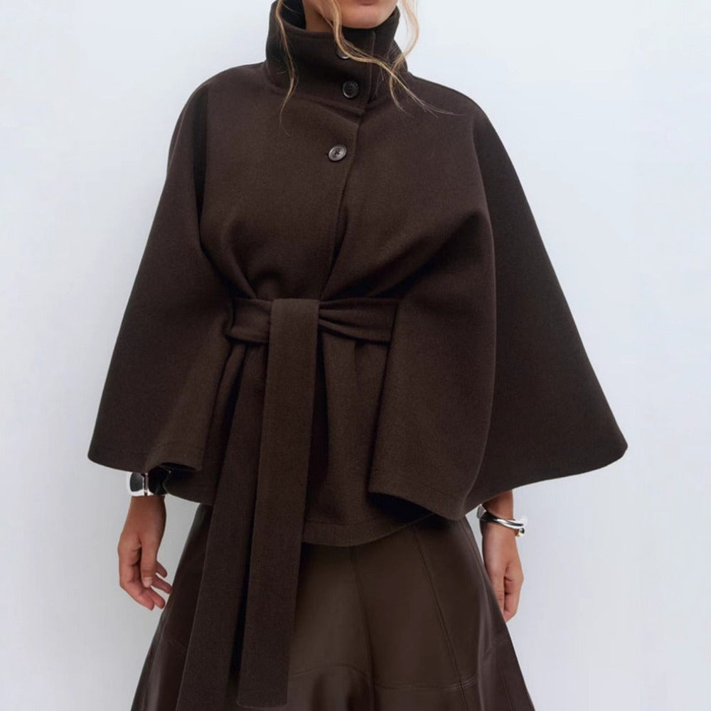 Women's high-collar cape coat in brown, front view with belt tie and buttoned neck