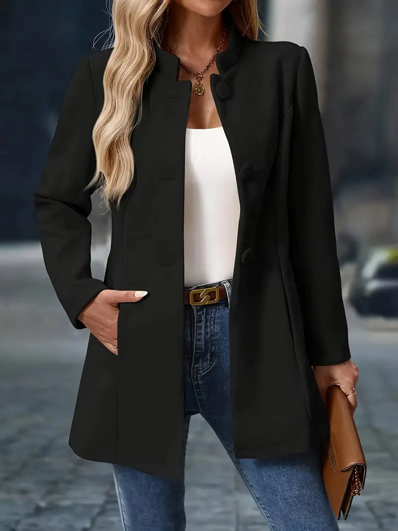 Black mid-length winter coat with buttoned stand collar, front pockets, and long sleeves