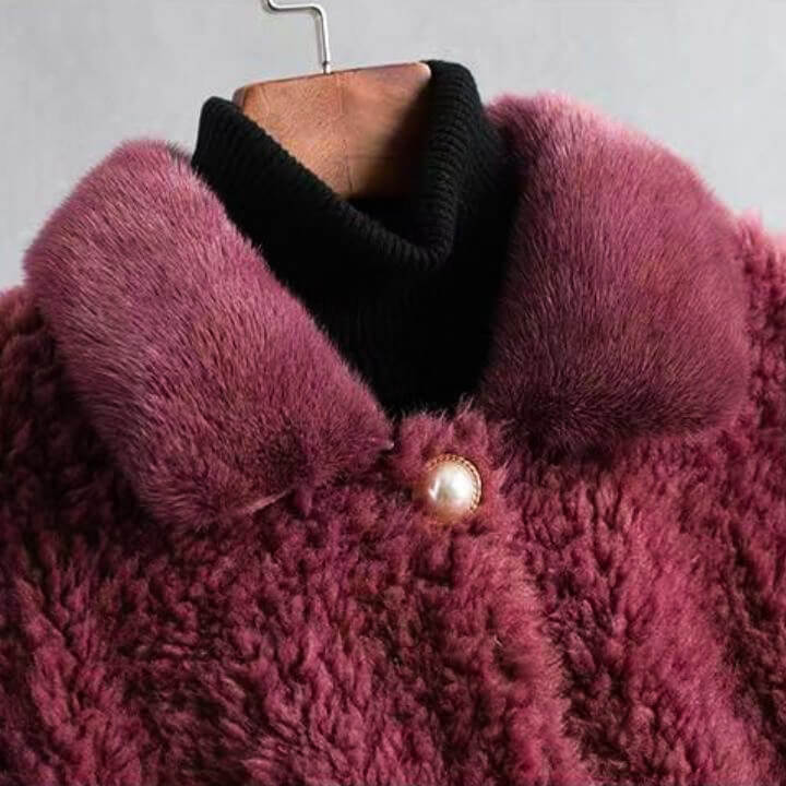 Burgundy shearling coat with black inner collar and pearl-style snap buttons