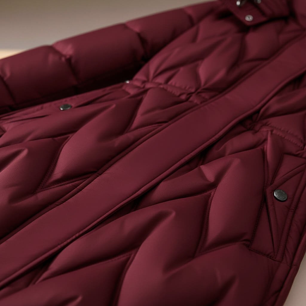 Rose red quilted coat detail with diagonal quilting and front button placket