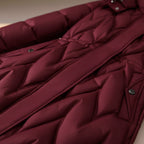 Rose red quilted coat detail with diagonal quilting and front button placket