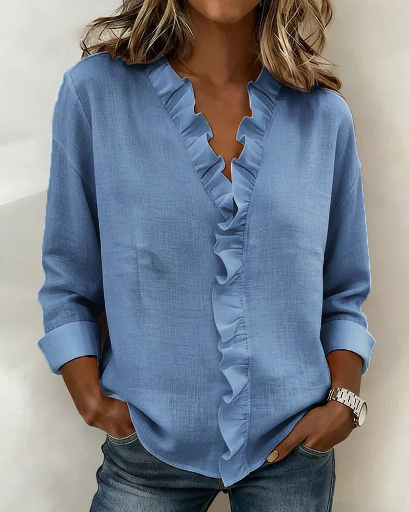 Blue ruffle-trim V-neck blouse with long sleeves