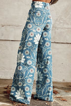 Boho wide-leg pants in blue with white floral print and stitched seams, side view