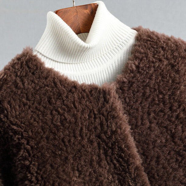 Brown shearling coat with ribbed white turtleneck, long sleeves, open front glimpse