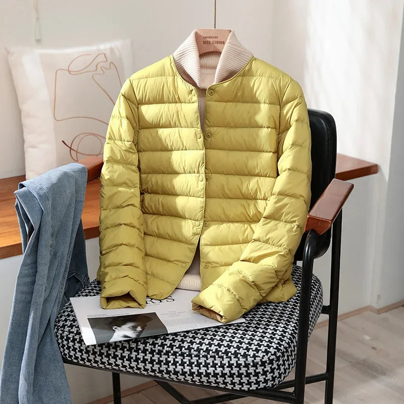 Lightweight quilted jacket in yellow with ribbed stand collar and snap front