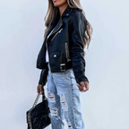 Women’s black leather jacket with stand collar, zip front, belt, and zip pockets