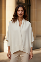 Wool-cashmere blend shawl wrap, light color, draped open-front design with soft knit edges