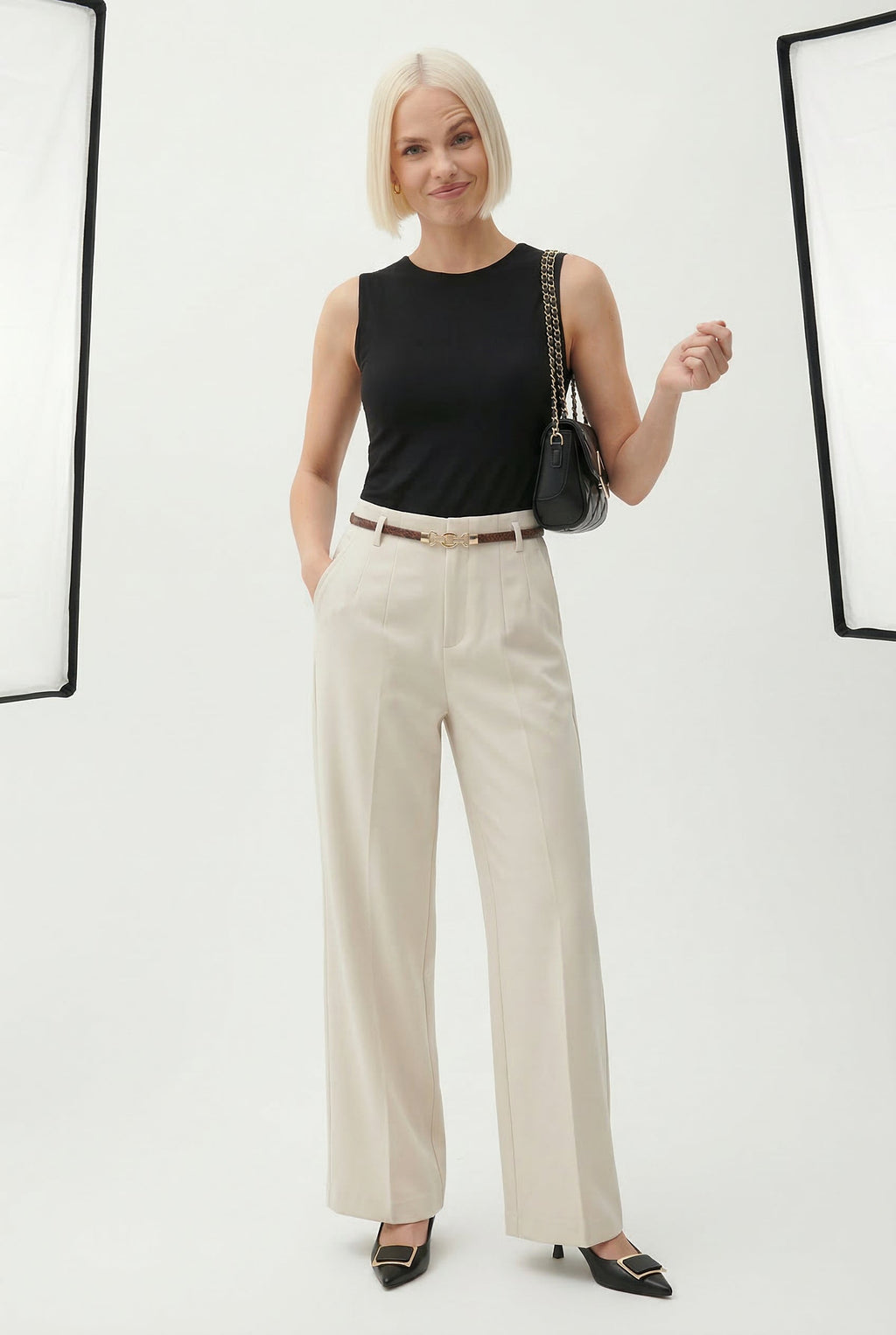 Cream high-waisted wide-leg trousers with belt and straight, relaxed legs
