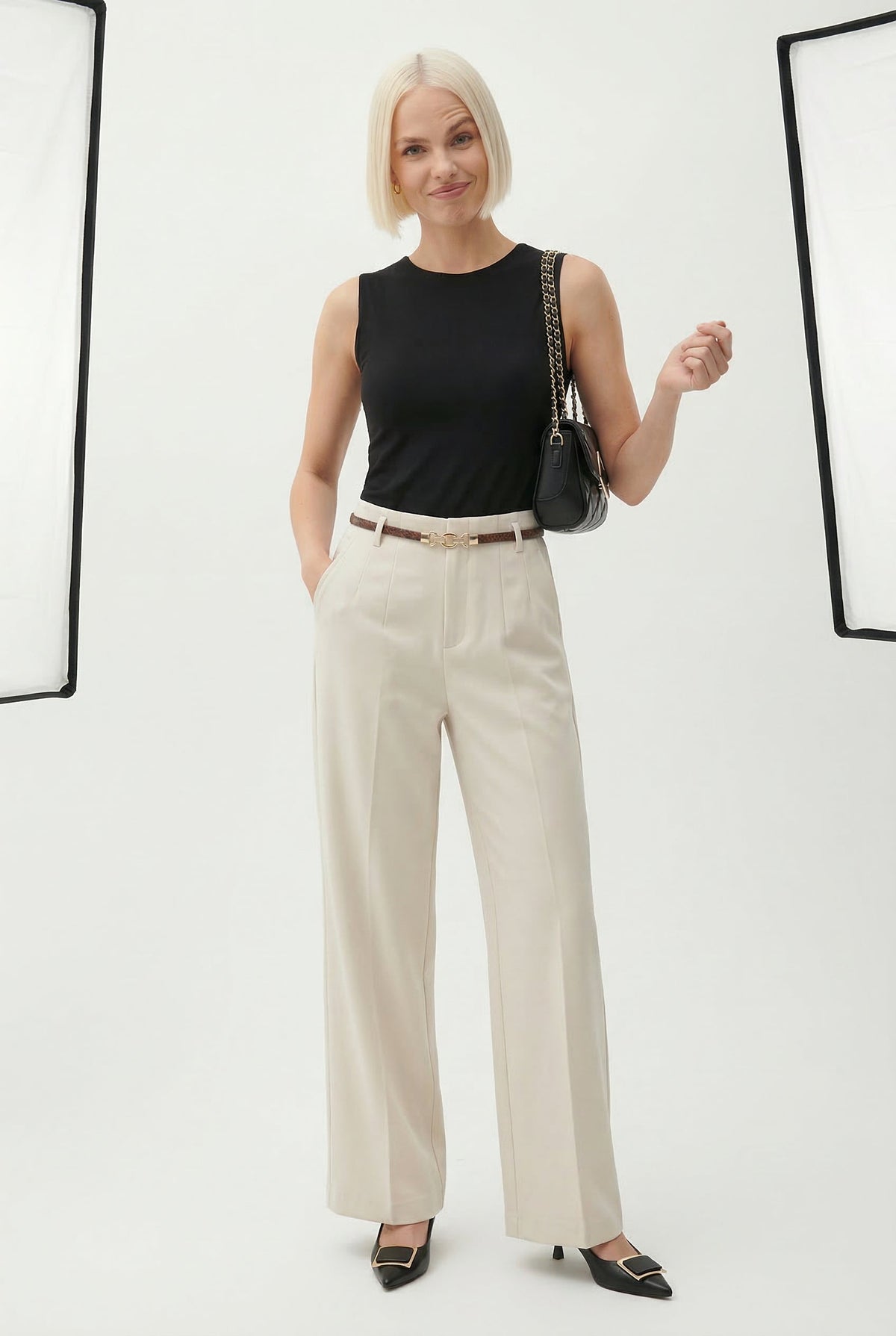Cream high-waisted wide-leg trousers with belt and straight, relaxed legs
