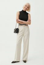 Ivory high-waisted wide-leg trousers with waist belt and pleated front