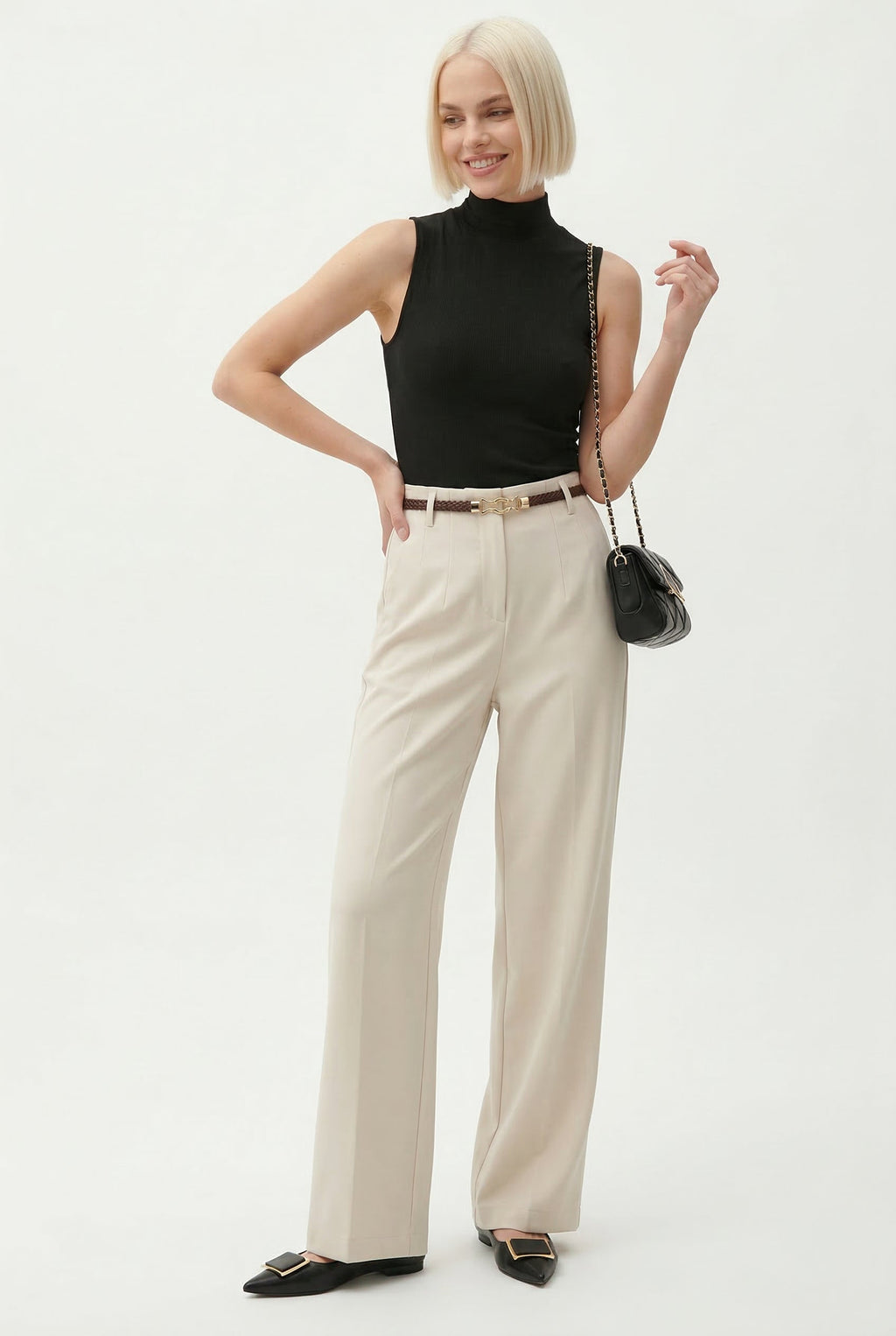 Cream high-waisted wide-leg trousers with belt, full-length view