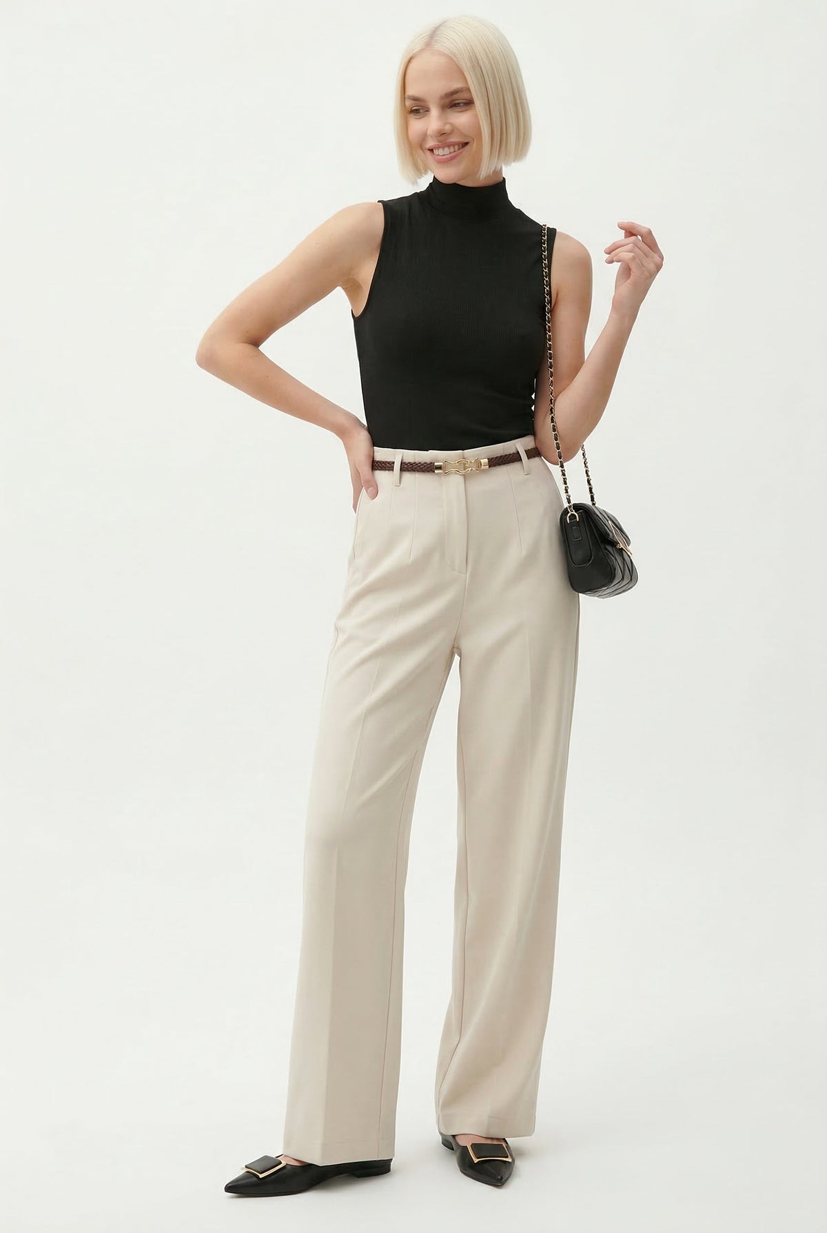 Cream high-waisted wide-leg trousers with belt, full-length view