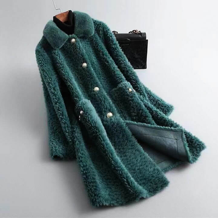 Mint green shearling coat with shawl collar, snap front, and flap pockets