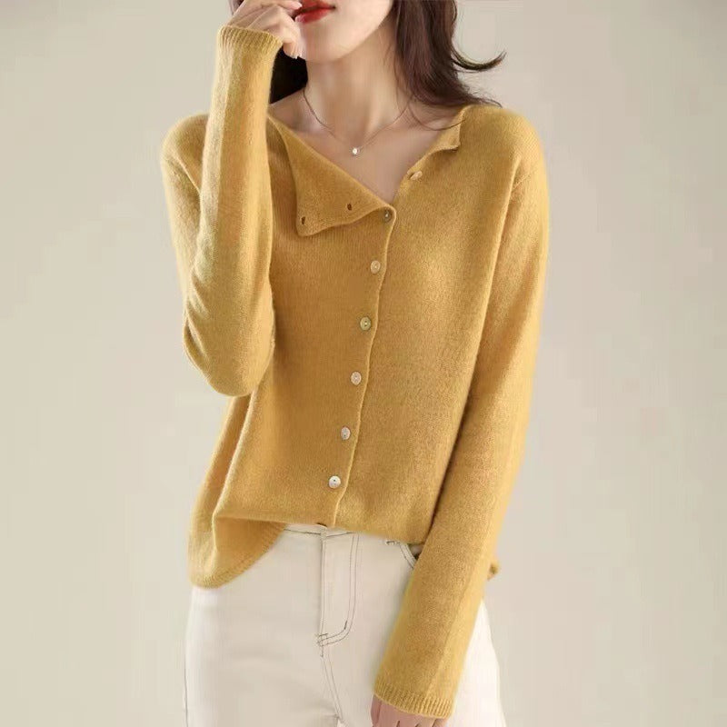 Mustard yellow knit sweater with V-neck and front buttons, ribbed cuffs