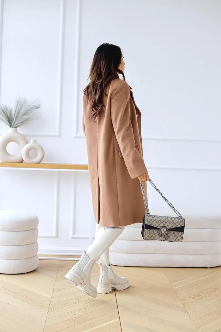 Camel brown double-breasted wool coat from back view, long sleeves, side slit styling