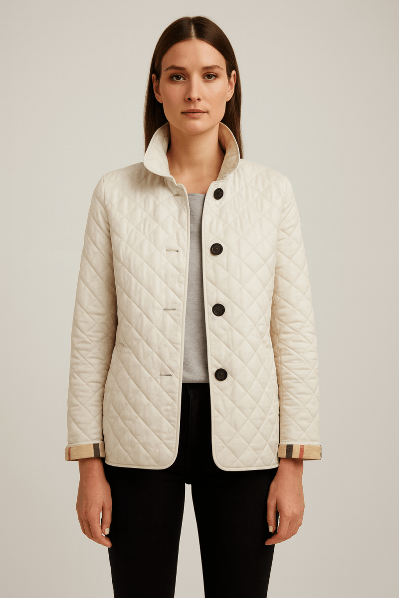 Quilted lightweight jacket, cream, button-front with stand collar and two pockets.
