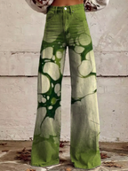 Wide-leg jeans with green abstract print, button waistband, full front view