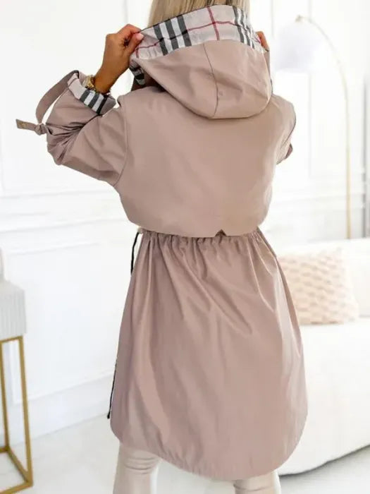 Women's taupe zip waterproof coat with hood, plaid lining, and adjustable drawcord hem