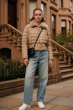 Beige cropped puffer jacket with faux fur collar and front zipper, belted waist