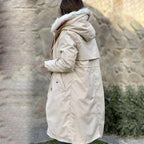 Cream waterproof women's parka jacket with fur-lined hood and drawstring waist